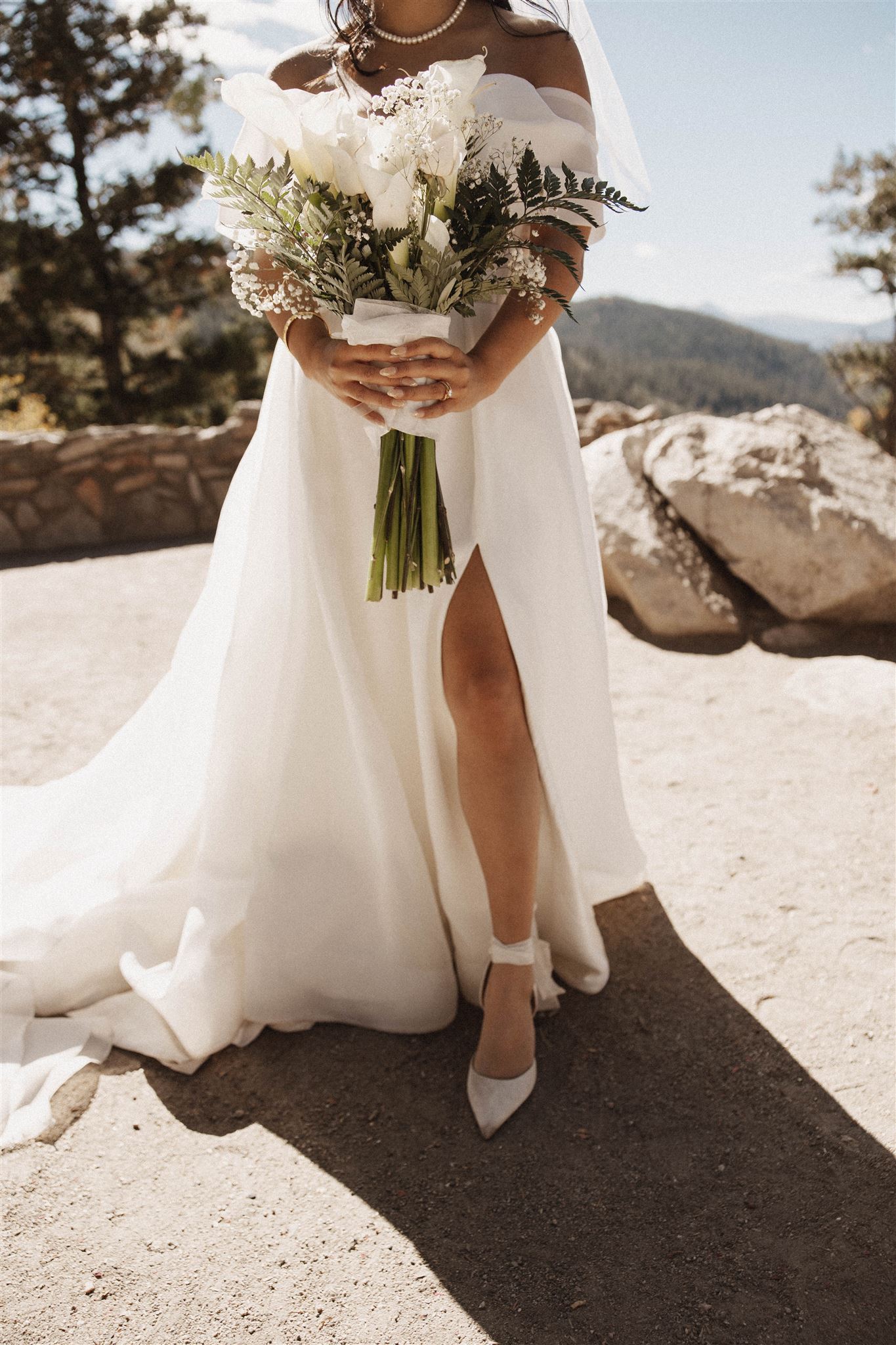 bridal portrait with her white flower bouquet