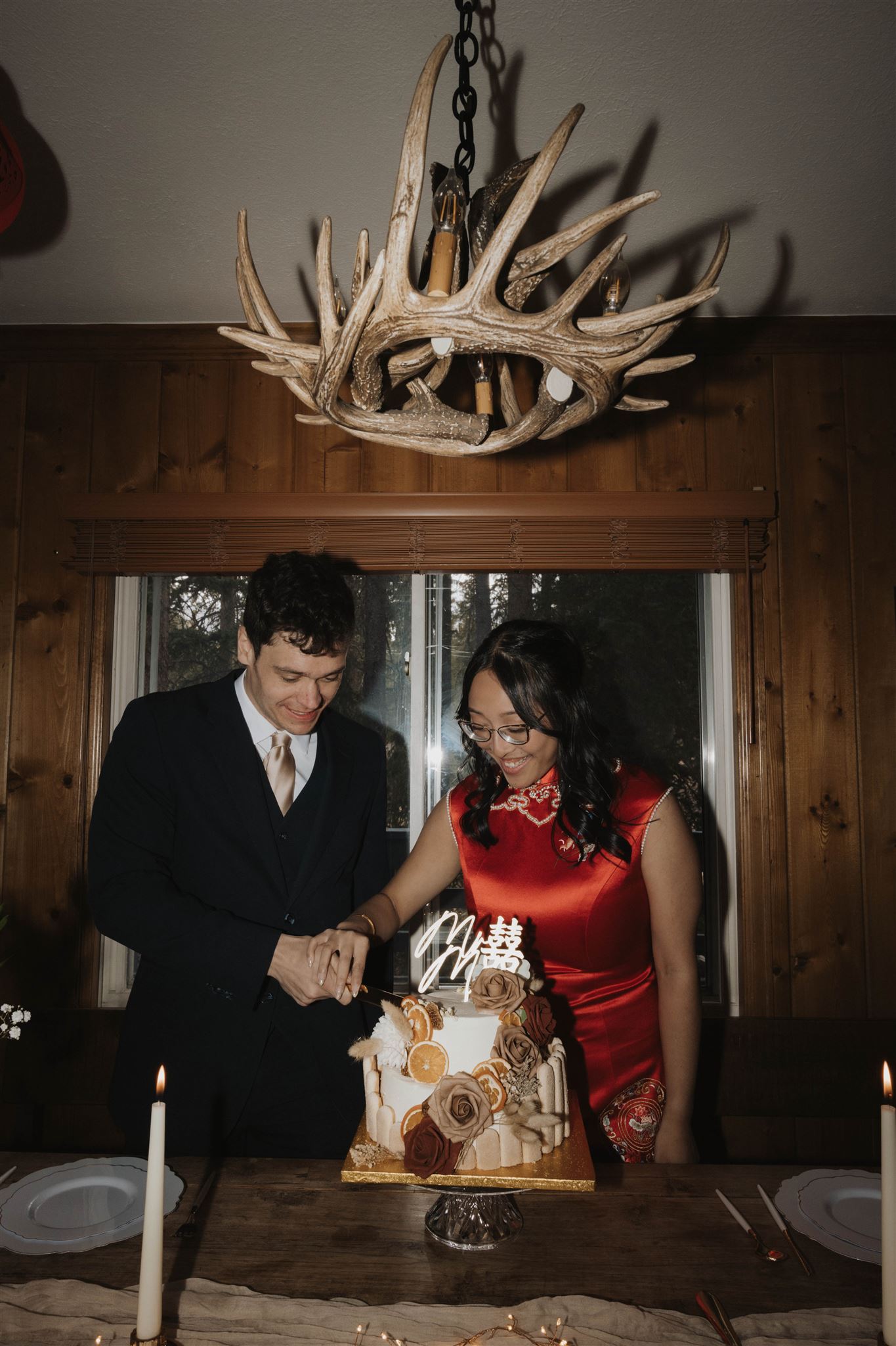 bride and groom cutting their wedding cake after Sapphire Point Elopement