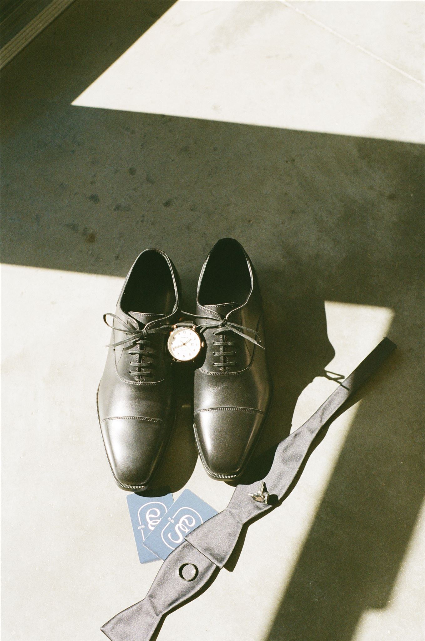 groom's shoes and details on film