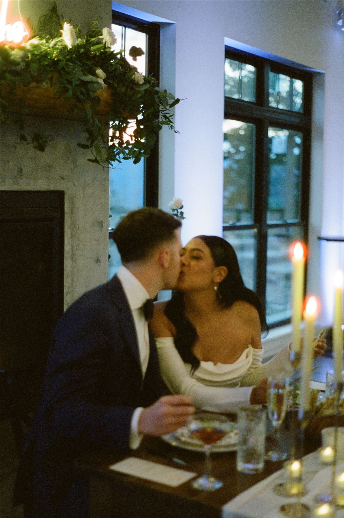 bride and groom kissing at the reception