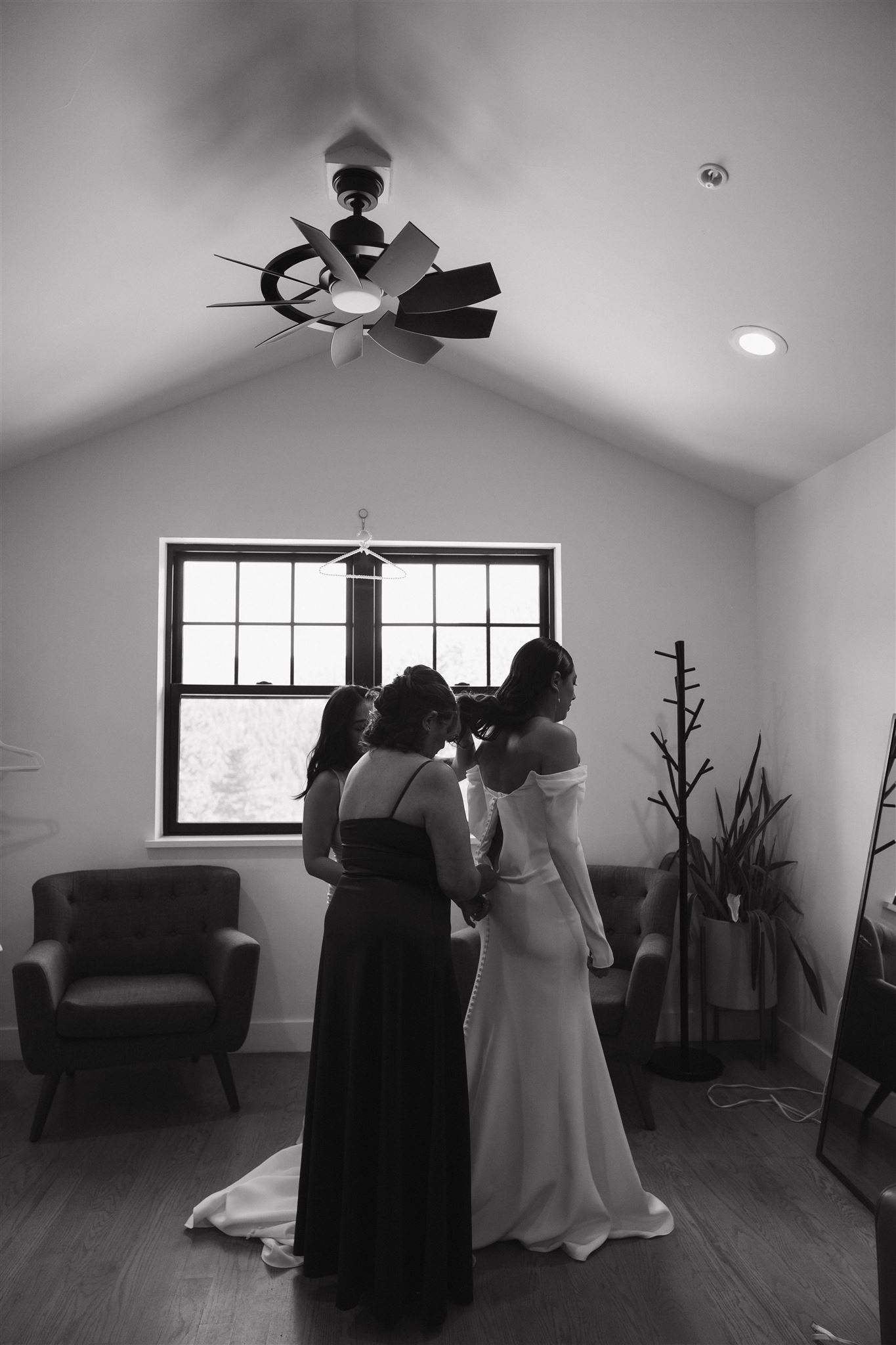 bride getting help with her dress for her Luxury Micro Wedding