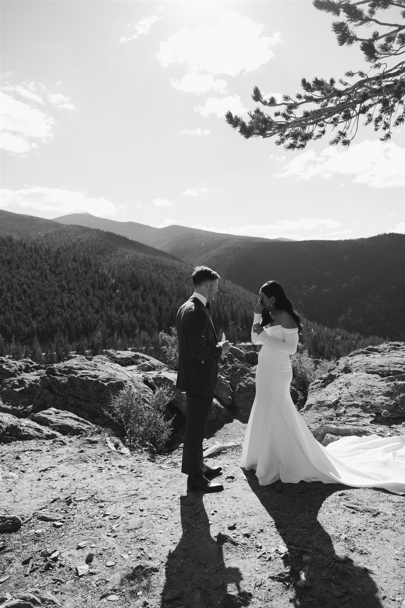 bride and groom getting emotional together with a mountain view 