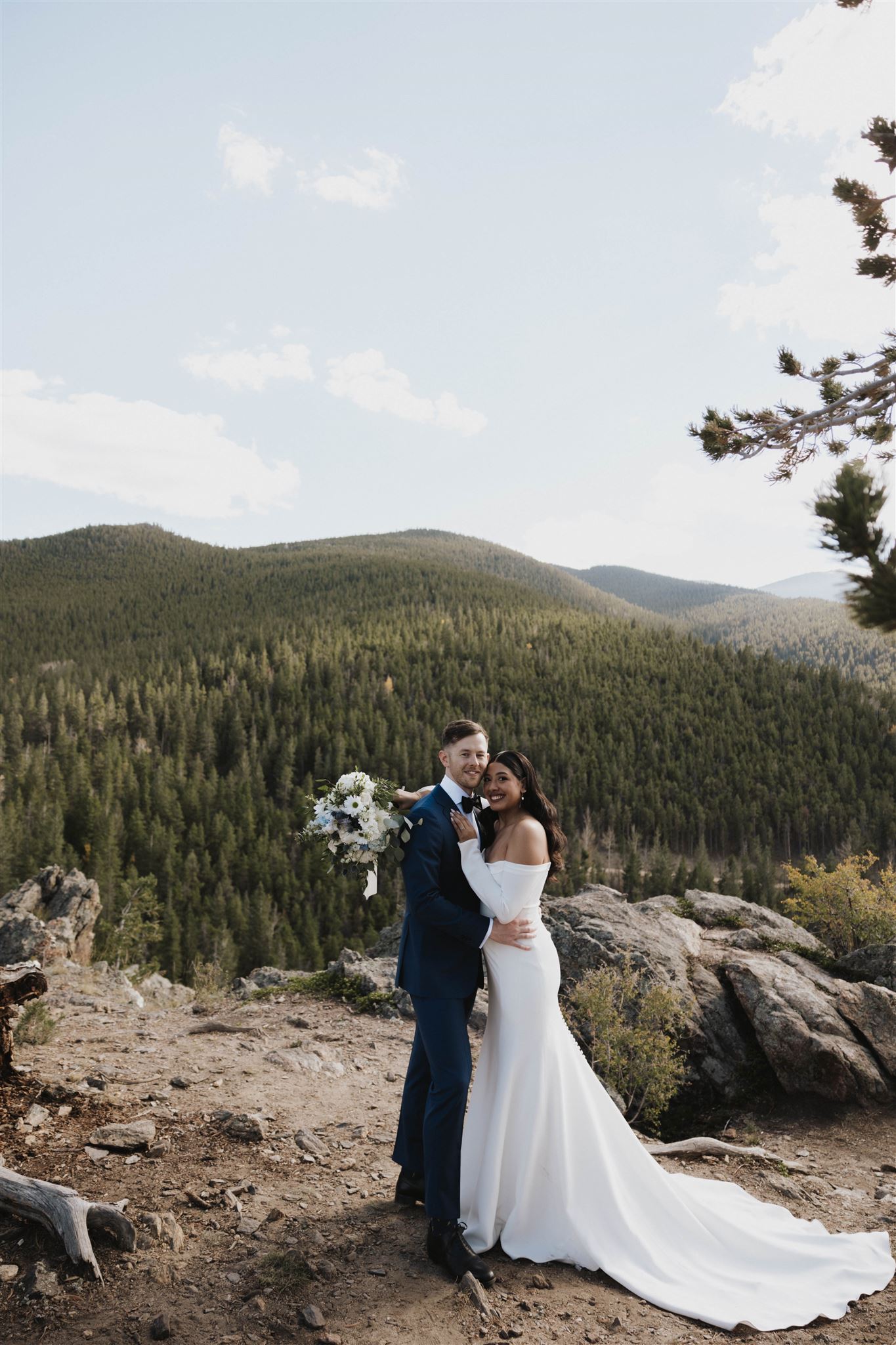 bridal couple portrait with the mountains in the background