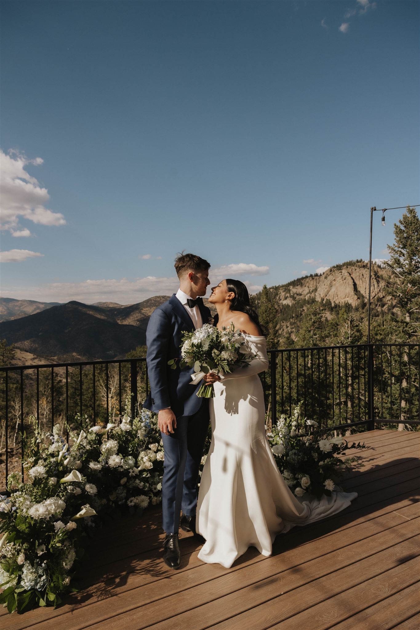 Luxury Micro Wedding couple at the ceremony space with mountain views 