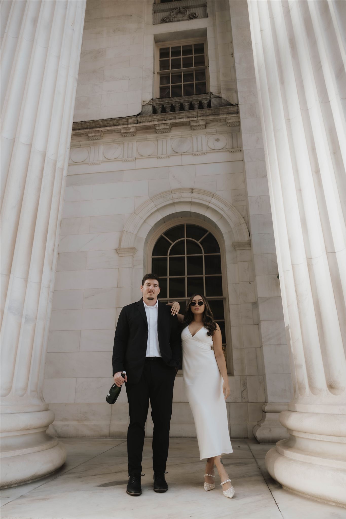 a man and woman standing together for some editorial engagement photos 