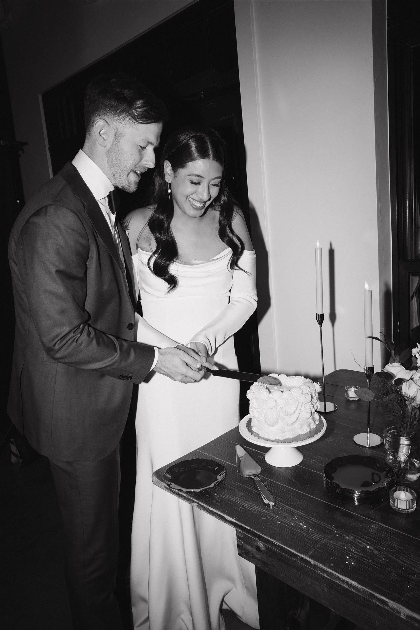 bride and groom cutting their Luxury Micro Wedding cake 