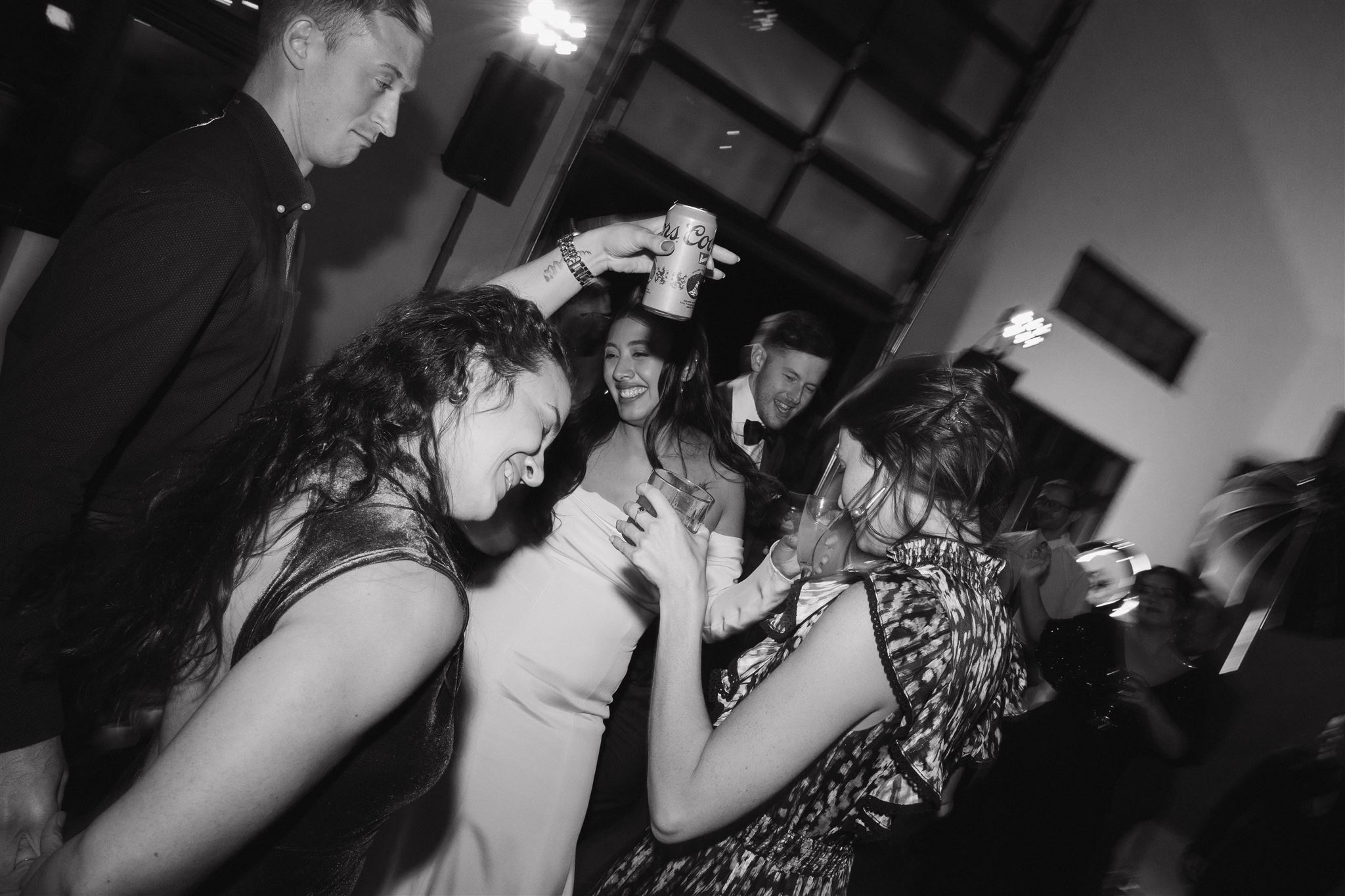 bride and groom and guests dancing 