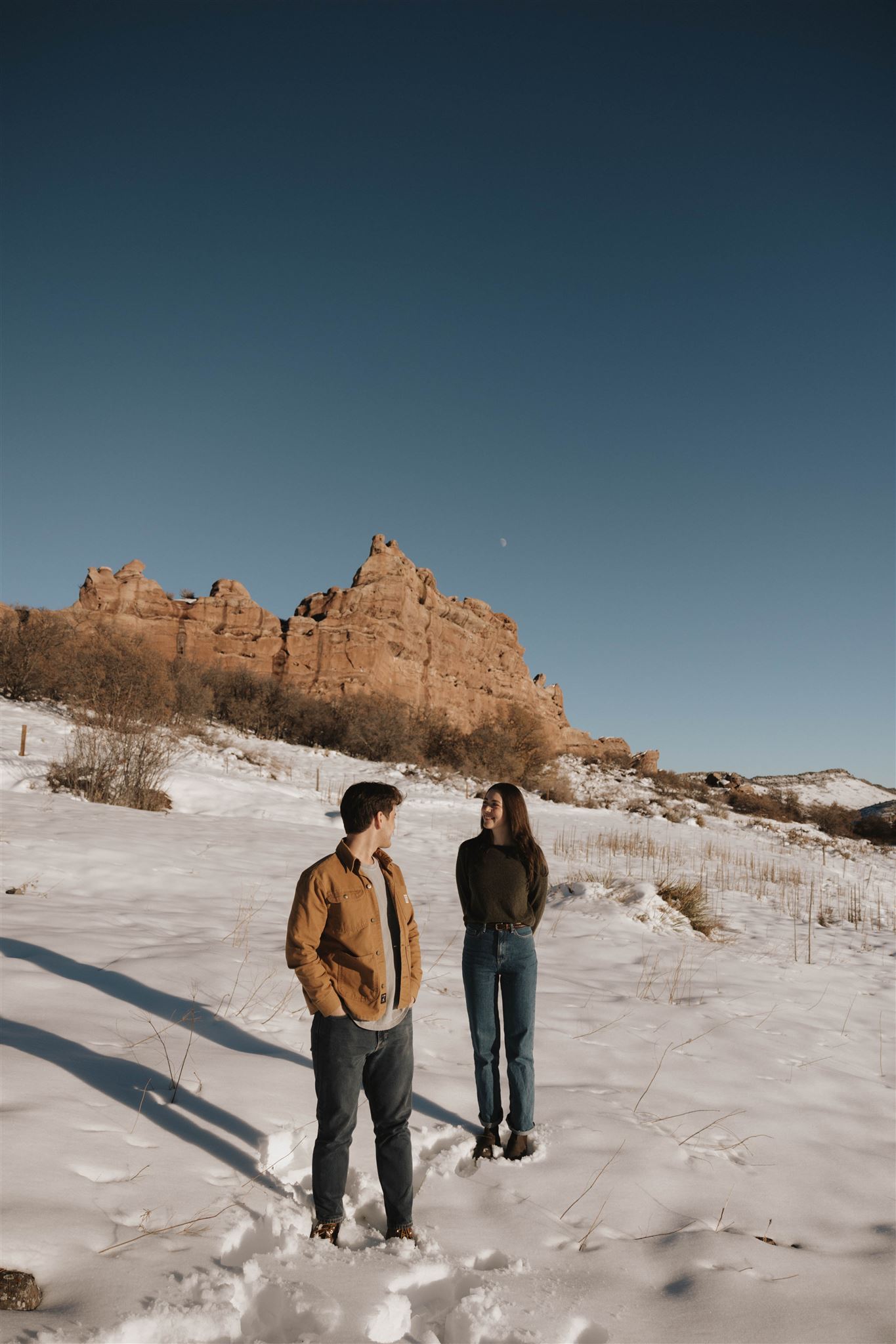 newly engaged couple in an editorial pose during their Snowy Engagement Photos