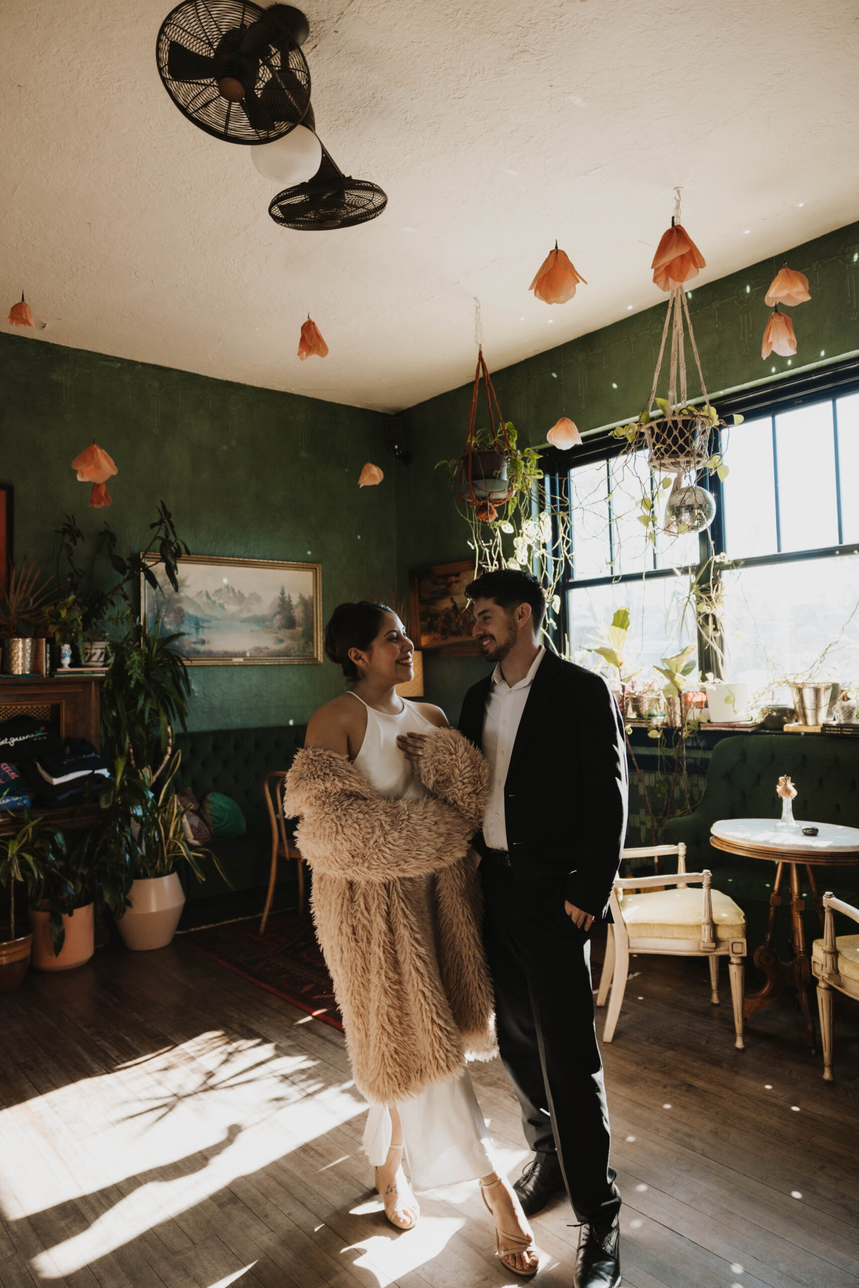 newly engaged couple smiling at each other at their Denver Engagement Photo Location