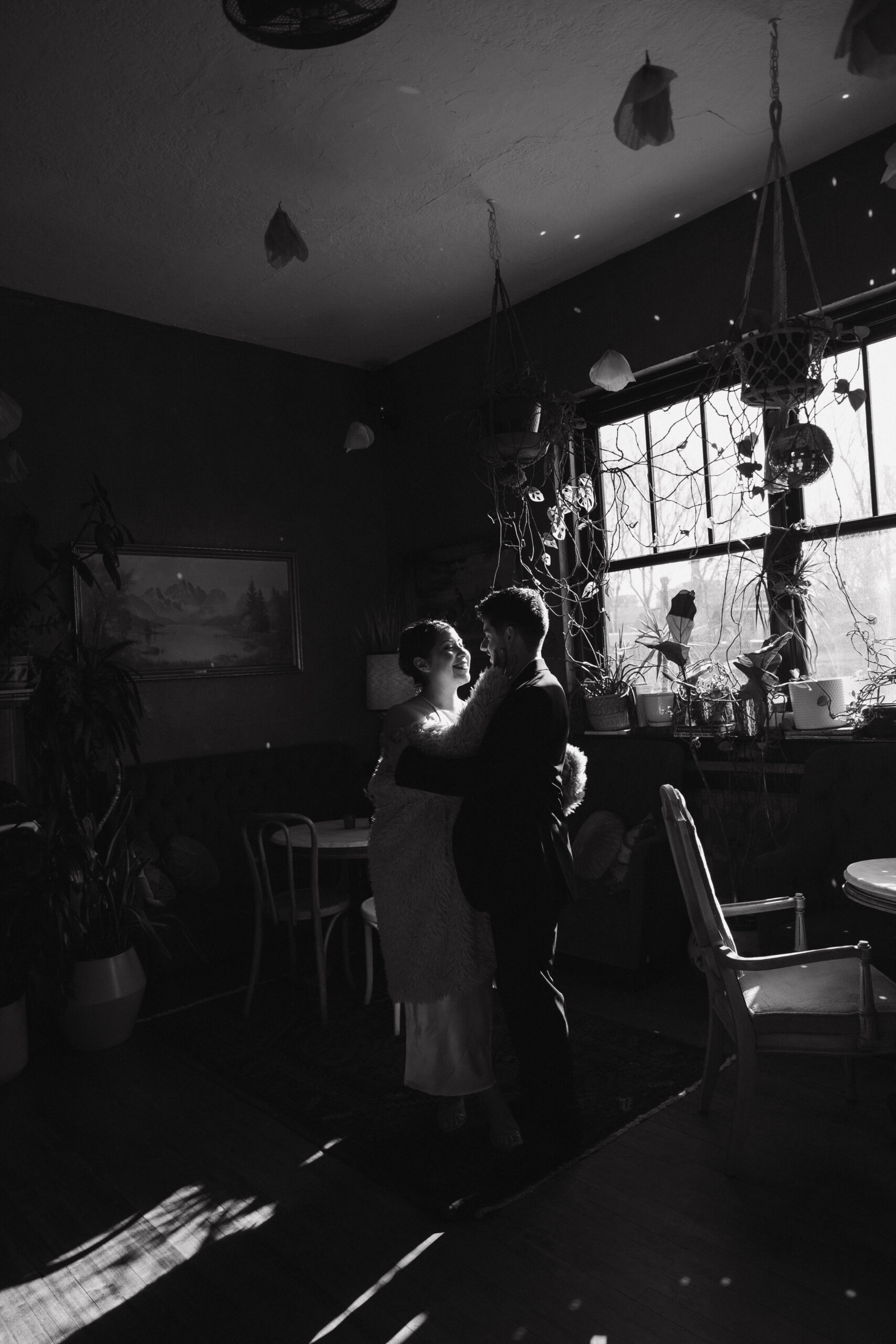 a man and woman holding each other during their engagement photos 