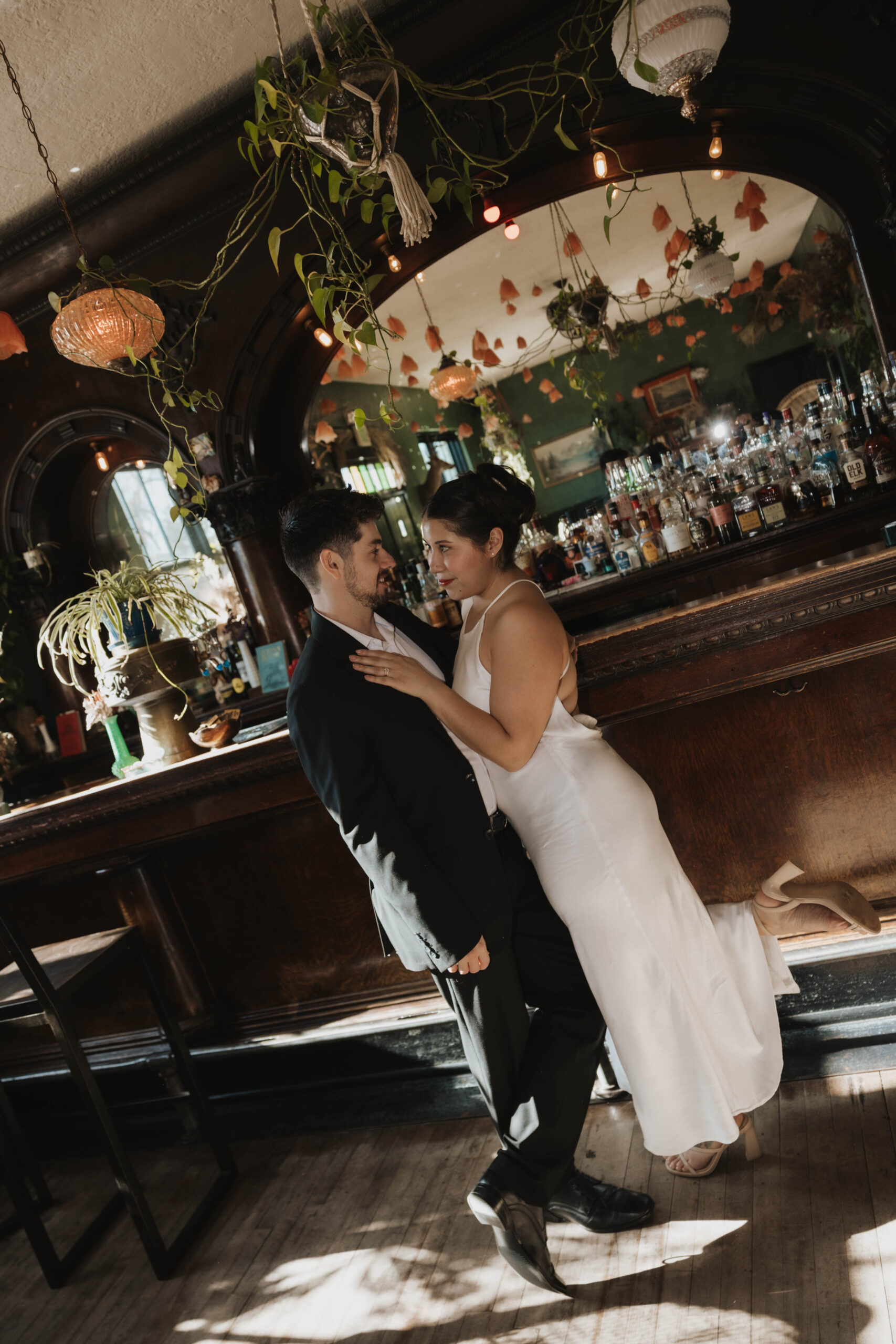 a man and a woman at a bar for their Denver Engagement Photo Location