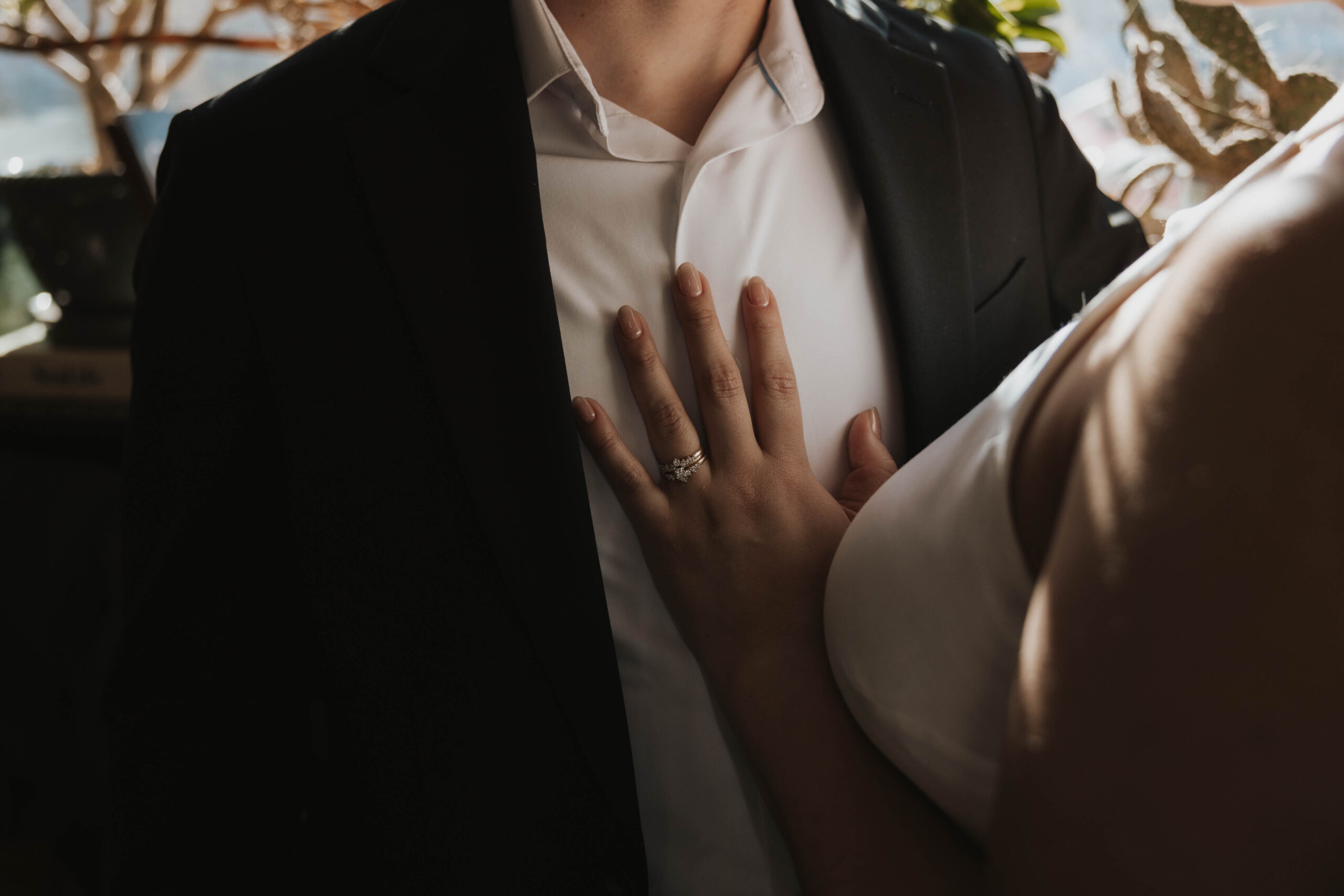 a woman's hand with her engagement ring on it