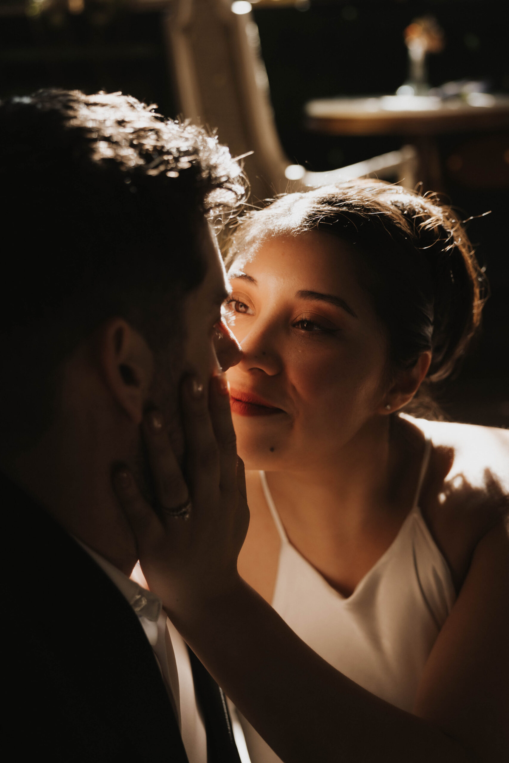 a woman looking into a man's eyes at their Denver Engagement Photo Location