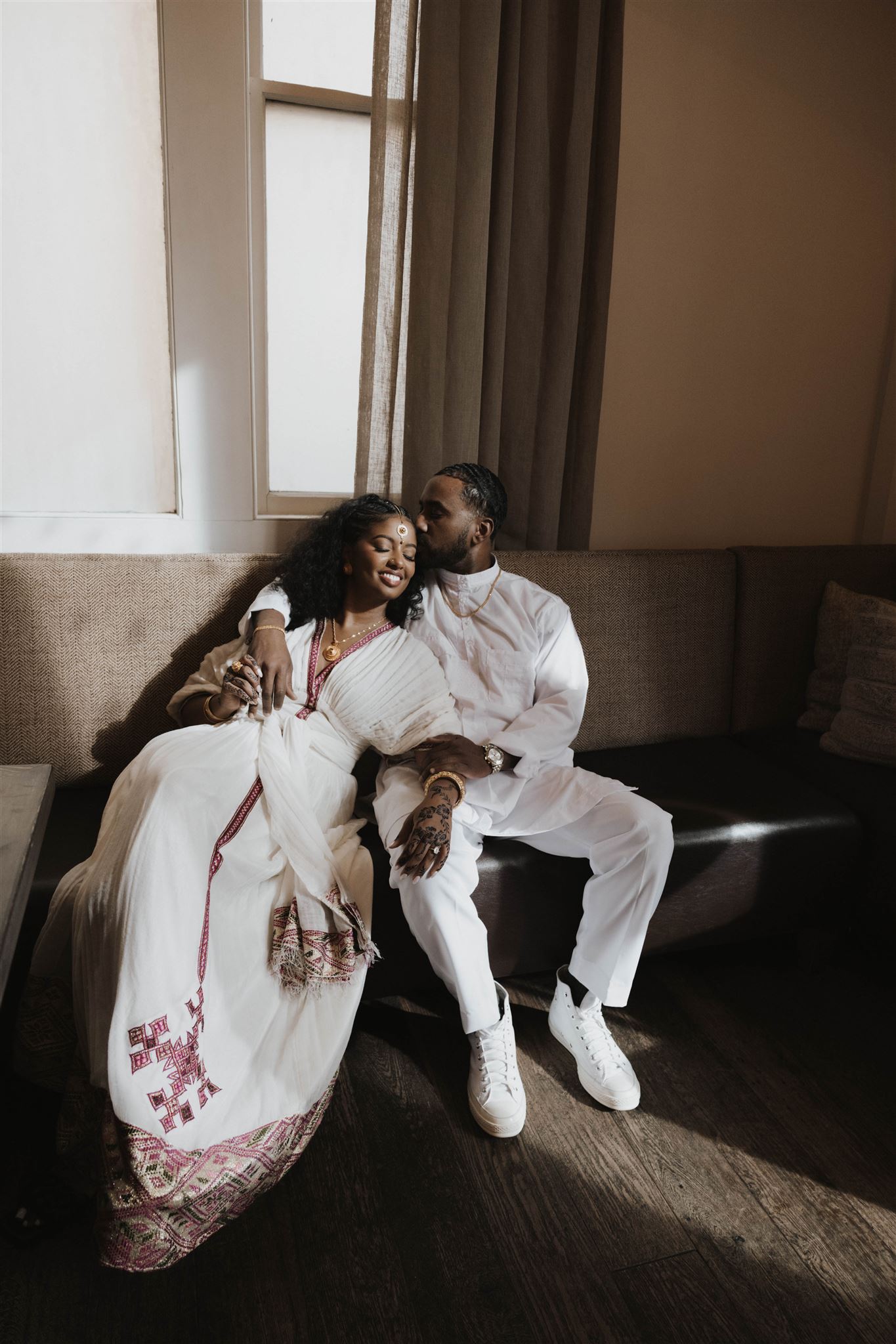 a couple sitting together during their unique engagement photos